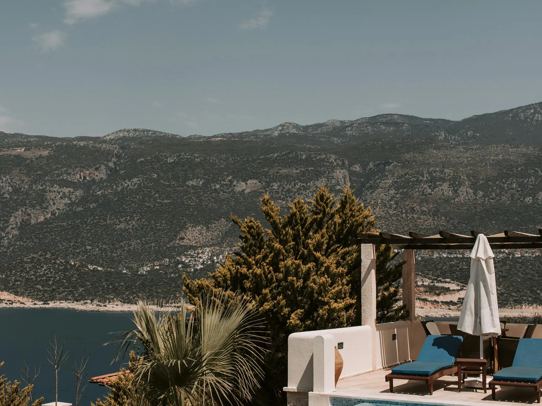 An overview of backyard setting with potential for installing an above ground pool, including insights on installation over different surfaces.