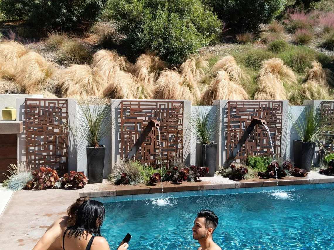 Stylish above ground pool with decorative elements for a modern backyard.