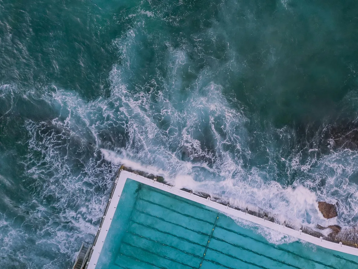 Aerial view of a swimming pool with clear water, showcasing the effects of Clorox pool chemicals.