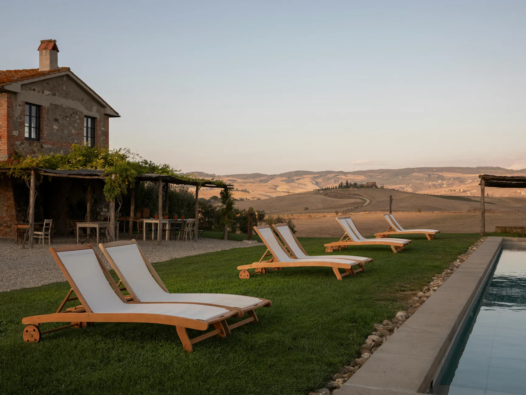 A serene backyard view featuring loungers and a pool, illustrating steps to close an above ground or saltwater pool.