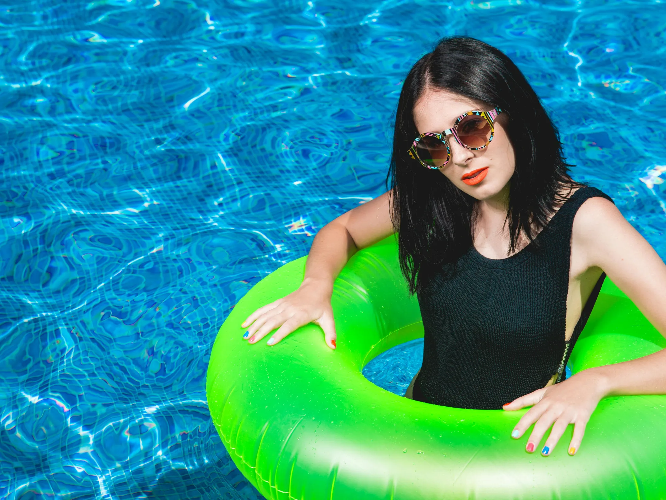 Image of a woman in a pool, representing the concept of excavation cost pool.