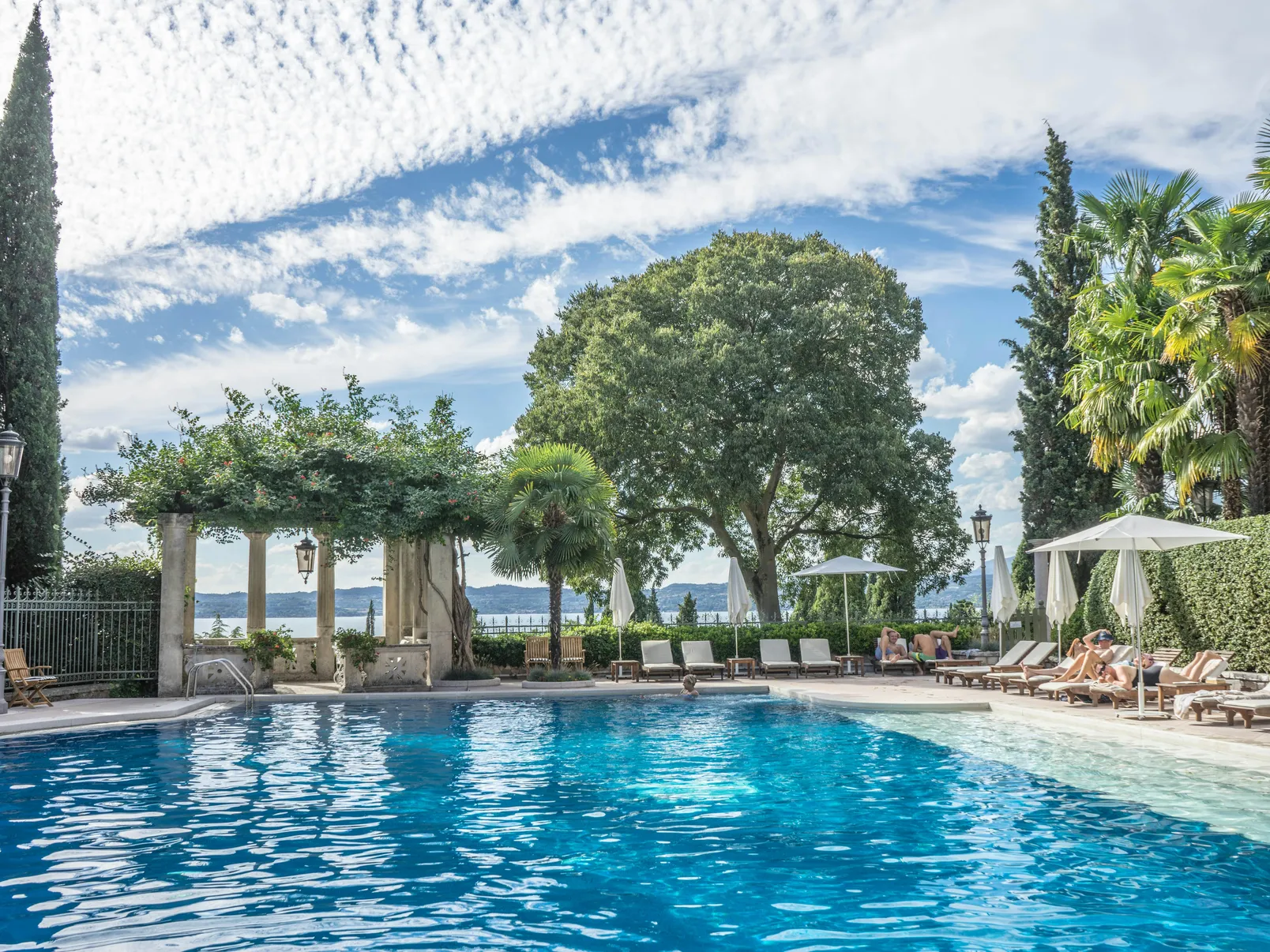 A beautiful fiberglass pool showing a clear blue surface, relevant to the discussion on whether fiberglass pools are slippery.