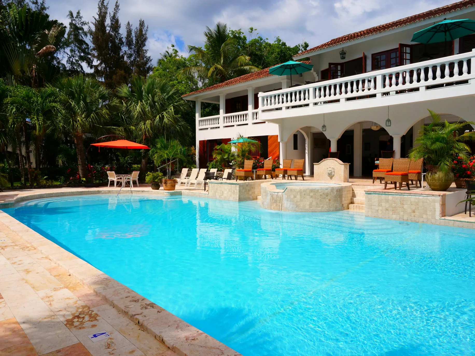 Beautiful luxury pool with landscaped surroundings, ideal for pool build cost calculator.