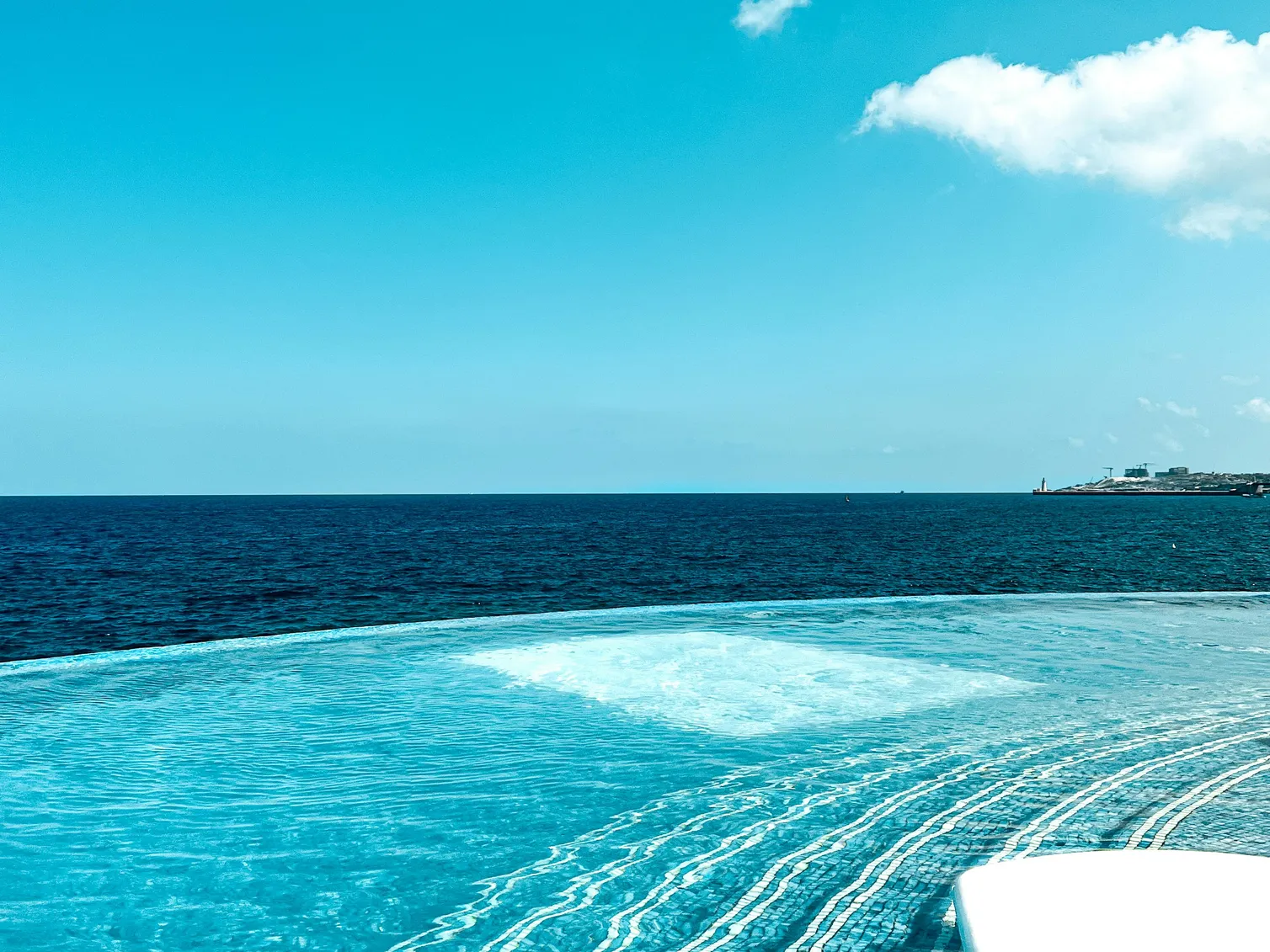 Clear swimming pool water highlighting the importance of pool filter grid replacement for maintenance