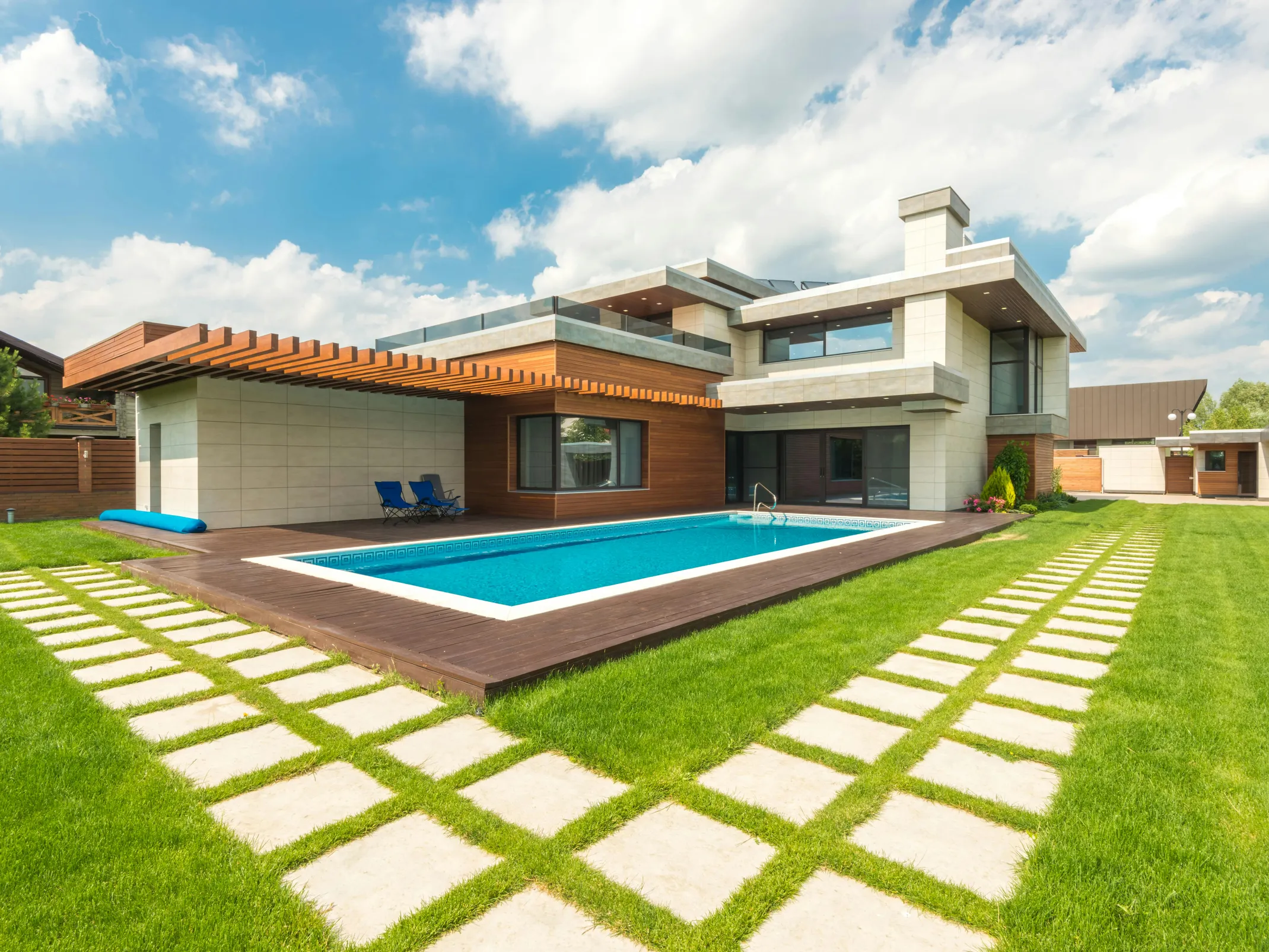 Modern home with a pool, discussing if you can shock your pool in the morning.