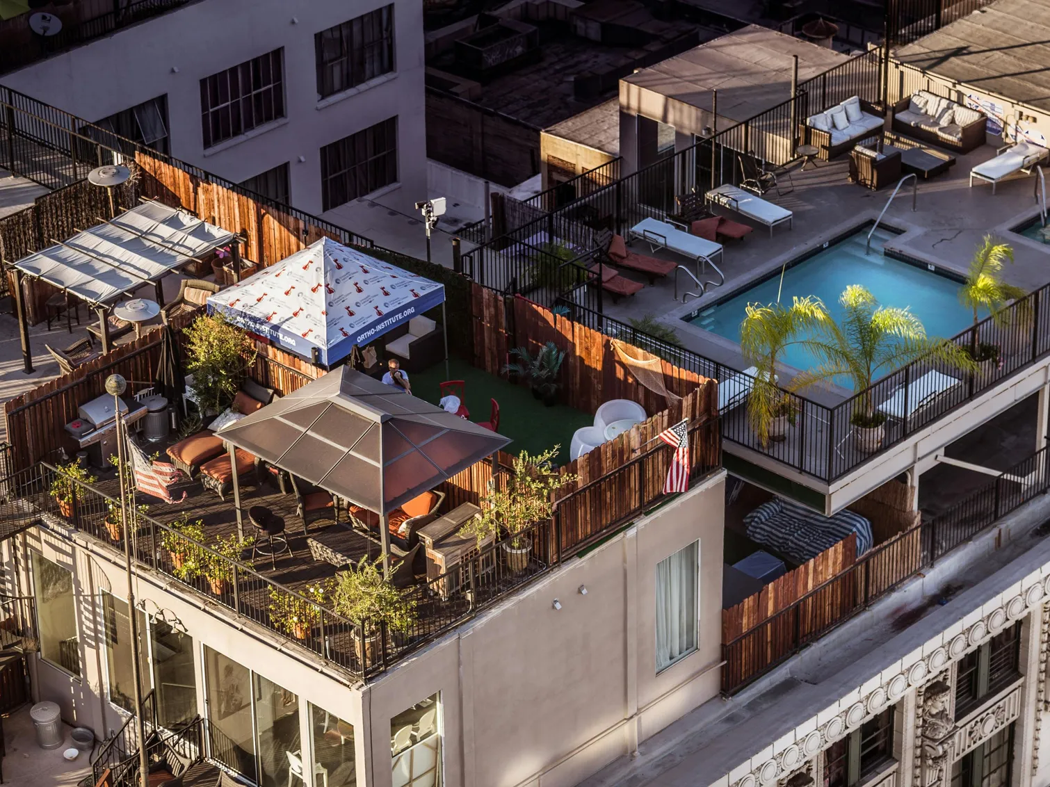 Aerial view of a pool area with seating, reflecting the question of swimming with floc in the pool.